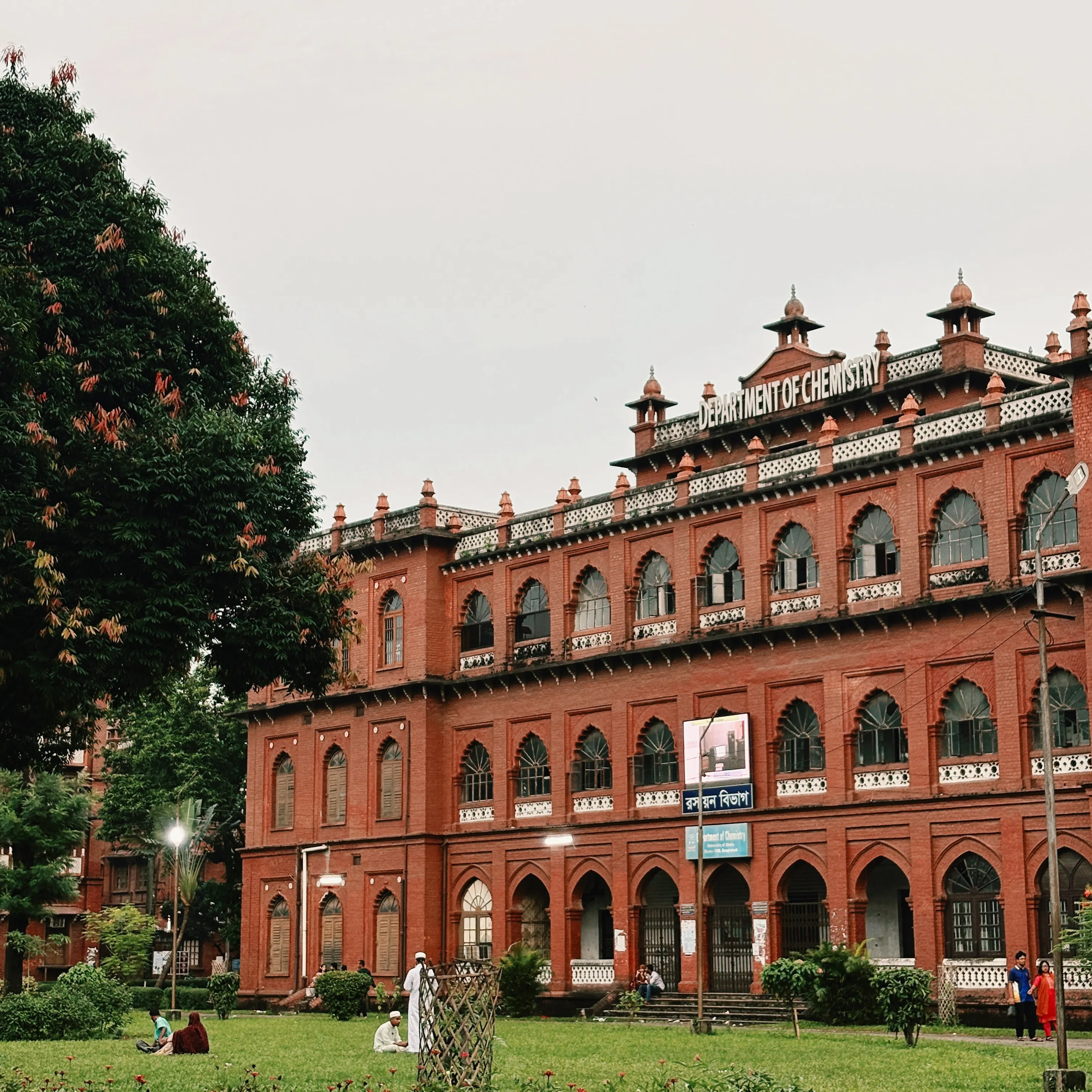 Elegant red brick chemistry department building of Dhaka university surrounded by greenery